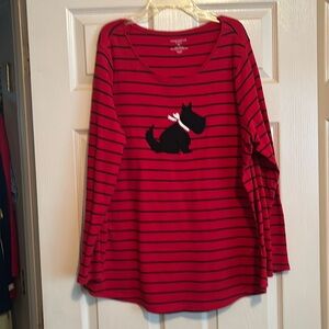 Red shirt with black strips and picture of puppy on front.